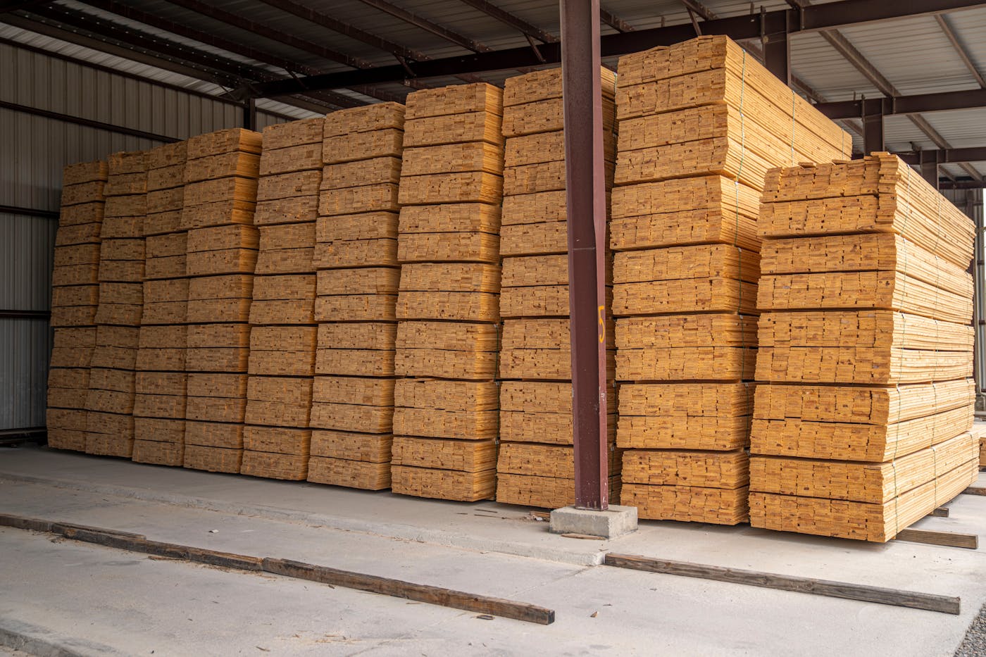 Lumber and wood planks stored in a warehouse